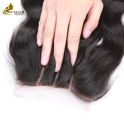 Chine Gros de bonne qualité brésilienne corps vierge vague cheveux humains 4*4 fermeture de dentelle à vendre