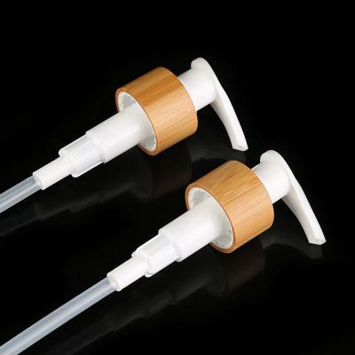 China Popular in stock plastic bottle manufacturers 24 28 410 white plastic PP actuator bamboo wooden covering lotion pump for sale