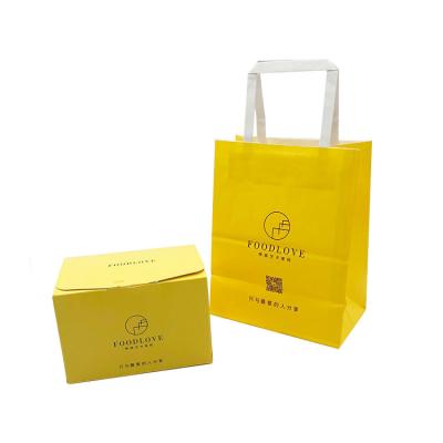 China Factory Direct Sale Recyclable Yellow Food Packaging Bag With Handle Kraft Paper Baking Packaging Bag for sale