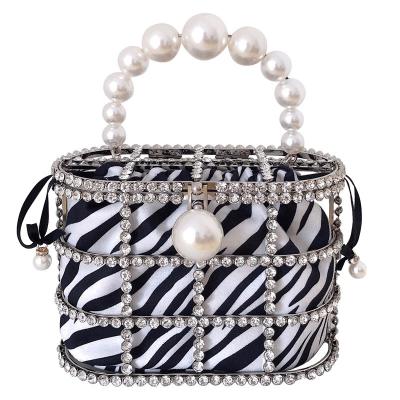 China Diamond Trends Women 2021 Shinny The Rhinestone Clutch Crystal Pearl Clutch Bucket Metal Party Cage Evening Handbag Zebra Clutch Prom for sale