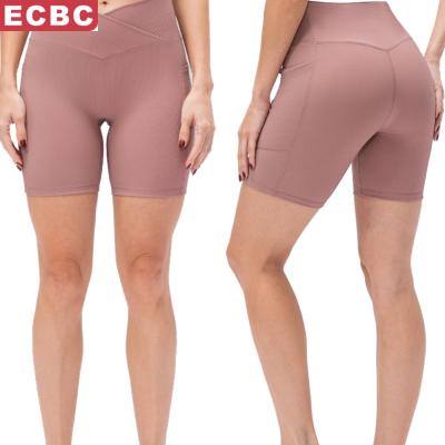 China 2022 New Yoga Spring Women's Breathable Yoga Shorts Cross Waist Tight Fitness Pants Pockets High Waist Hip Lifting Sports Running Shorts for sale