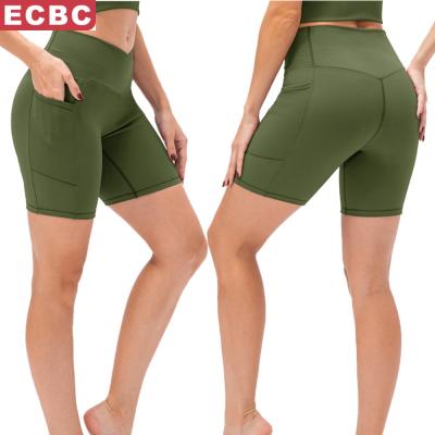 China 2022 New Women Breathable Yoga Shorts Cross Waist Tight Fitness Pants Pockets High Waist Hips Running Sports Shorts for sale