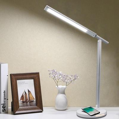 China Eye care lighting 3 color multifunctional dimmable stepless foldable desk led table lamp with 10w wireless charger for sale