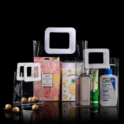 China Custom Shopping Logo Plastic Bulk Transparent Pvc Shock Resistance Tote Bag Clear Gift Bags With Handles for sale