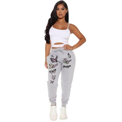 China Anti-pilling new sport casual pants printed butterfly bottom narrow leg pants for sale