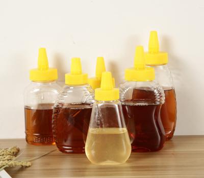 China Food Industry /Drink Container/Custom Honey Jar 250ml 300ml PET Shape Plastic Squeeze Honey Bottle Cosmetic Packaging Bottle With Dropper Cap Hexagon Bottle for sale