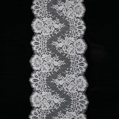 China Soft Latest Style 2021 Delicate Floral Beads Embroidery French Lace Mesh Fabric For Women for sale