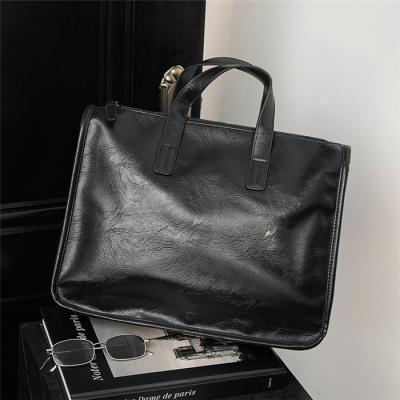 China Newspaper used 2022 new business laptop handbag shoulder bag waterproof PU leather briefcase for men custom logo for sale