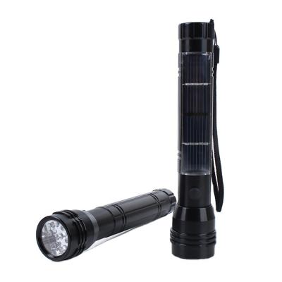 China Solar torch with mobile radio emergency power bank charger slot flashlight 7 led solar torch with radio for sale