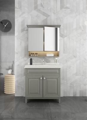 China Grijs roestvrij staal badkamer vanity met elegante spiegelkast en gevormde deur Te koop