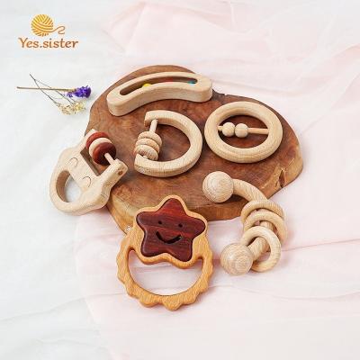 China Soft Educational Kids Ring Wood Baby Rattles Toys Montessori Food Grade Wooden Teether for sale