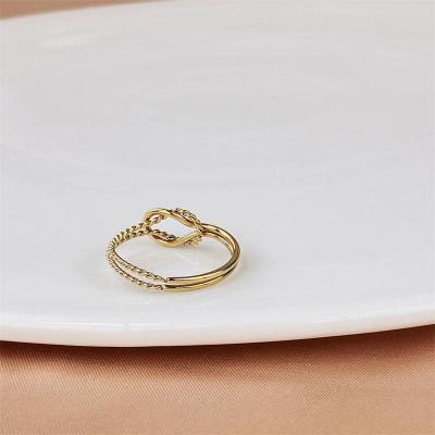 China CLASSIC simple double-layer cross-opening real twisted titanium steel 18K gold plated knotted rings for girls for sale