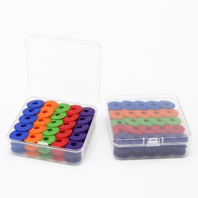 China Wholesale 50pcs Sewing Machine JP Color Plastic Empty Bobbins Sewing Thread Twine Spools For Sewing Machine for sale