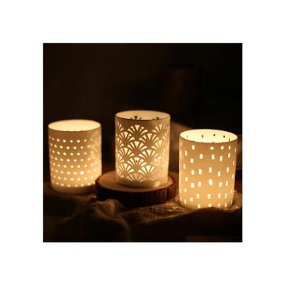 China Eco-friendly Porcelain Hollow Candle Cup Candle Holder Decorative Candle Holder for sale