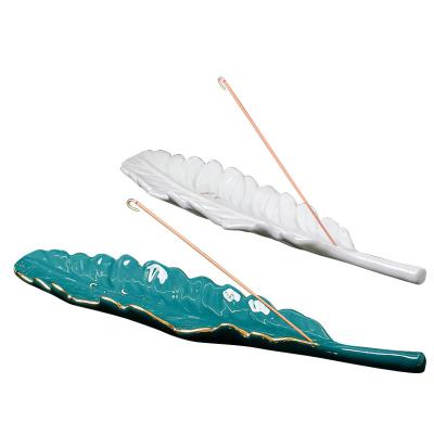 China Hot Sale Chinese Popular Ceramic Aromatherapy Burner Incense Stick Feather-Shape Incense Burning Incense Censer with Gold Rim for sale