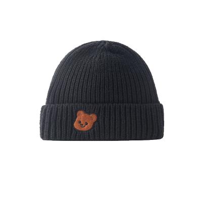 China Wholesale Unisex Black Solid Winter Casual Warm Knit Beanie Hat Cap Embroidered Slapped Logo for sale