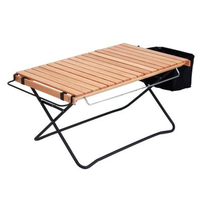 China AIMOYU Modern Outdoor Wood Top Frame Iron Frame Portable Camping Egg Roll Folding Table with Storage Bag for sale