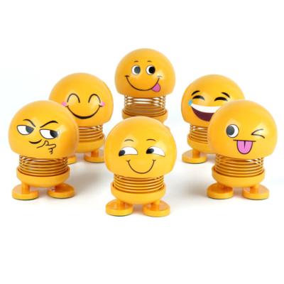 China Hot Selling Funny Emojied Moving Head New Arrival Toy Car Expression Figure Shaking Face Spring Funny Smile Doll for sale