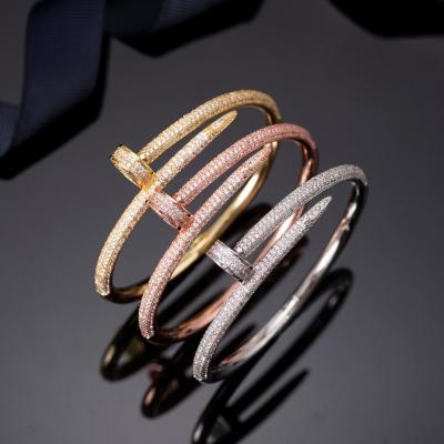 China Silver Plated Bling Crystal Cubic Zirconia Nail Shaped Hip Hop Bangle Glitter Bangle Religious 24k Gold Nail Bangle for sale