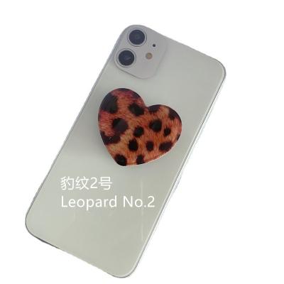 China Universal Adjustable Heart-Shaped Phone Holder Leopard Phone Grip Handle UP Fold Lazy Telescopic Stand Phone Holder for sale