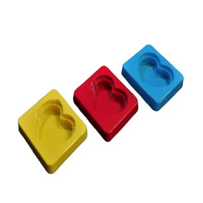 China Custom Food Heart Shape Colored PS Blister Tray Chocolate Wrapping Tray for sale