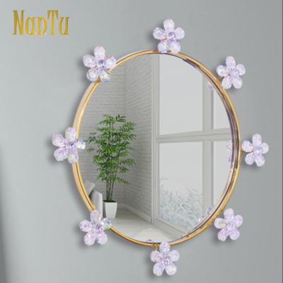 China Girls Bedroom Minimalist Metal Framed Flower Decorative Oval Wall Mirror for sale