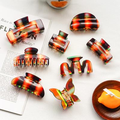 China Custom New Arrival Cins Fashion Hair Accessories Women Hair Claw RARA Women Hair Cut Wholesale Colored Acrylic Laser Hair Claw for sale