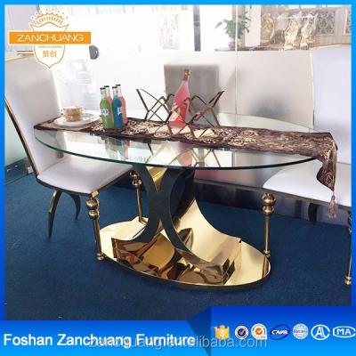 China Modern restaurant living room stainless steel dining table with glass for sale