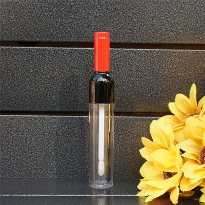 China Low MOQ Empty Orange Plastic Lip Gloss Bottle With Colored Wine Shape Creative Portable Lip Gloss Tube for sale