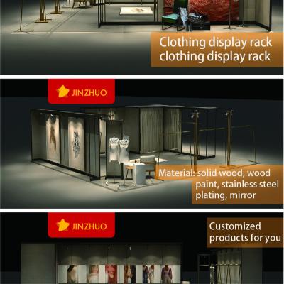 China Metal Hanging Display Clothes Racks Retail Clothing Store Display Stand Wood Garment Shelf Wall LED Light Display Racks For Shops Customized for sale