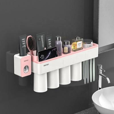 China Amazon New Design Sustainable Wall Mount Plastic Automatic Squeezing Toothpaste Dispenser With Magnetic Toothbrush Holder And Tumbler Cups for sale