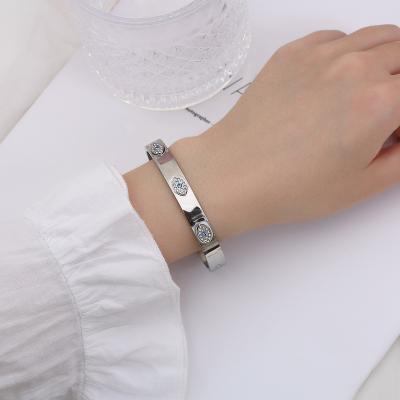 China 2022 fashion men's silver white bracelet with evil eye bracelets stainless steel blue stone demon eye bangle bracelet for sale