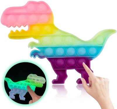 China Relieve stress trigger silicone push bubble stir Sensory Toy Glow Dark Fluorescent Dinosaur noise fidgety person toys for sale