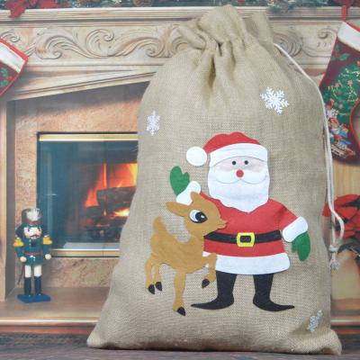 China Lovely Customized Eco-Friendly and Reusable Drawstring Bag Christmas Decoration Santa Gift Candy Storage Bag for sale