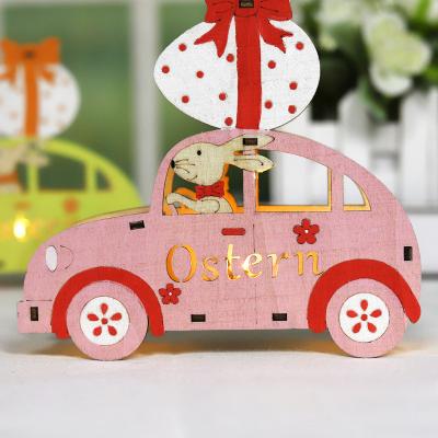 China Cute Car Shaped Egg Topper Rabbit Driver Led Easter Decoration Light Up Desktop Home Decoration Wood Crafts for sale