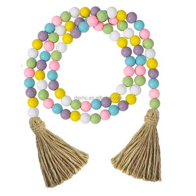 China 2022 Festival Decoration Easter Wooden Bead Garland with Tassels Farmhouse Beads Rustic Ornament Room Kid Home Decor Wall Hanging for sale