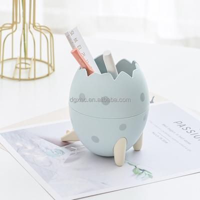 China Single Storage Box Office Home Festival Decoration Desktop Stationery Cute Dinosaur Egg Pen Holder for sale