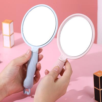 China Double-Sided Cartoon Portable Vanity Mirror With Handle Student Makeup Mirror HD Small Dormitory Lighting Outdoor Handheld Mirror for sale