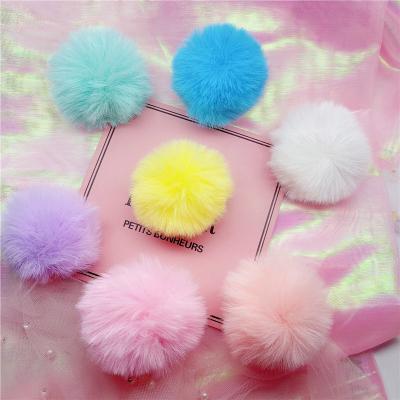 China Adjustable Soft Rabbit Fur Plush Ball Raising Up Mobile Phone Grip Stand Holder for sale