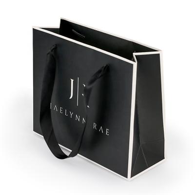 China Guangzhou High Quality Recyclable Custom Printing Matt Black Color Paper Gift Bag With Rope Handle for sale