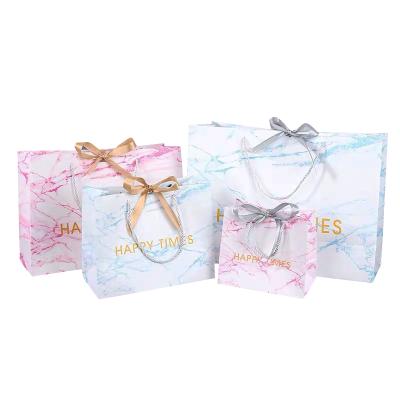 China Recyclable China Manufactures Small White Luxury Carrier Wedding Logo Printed Paper Gift Bag Custom Made With Handle for sale