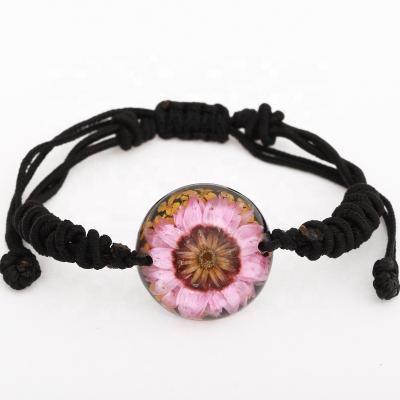 China Real Flower Embedded Fancy Gift Pretty Flower Bracelet 22 Mm Half Dome Shape Resin Bracelet for sale