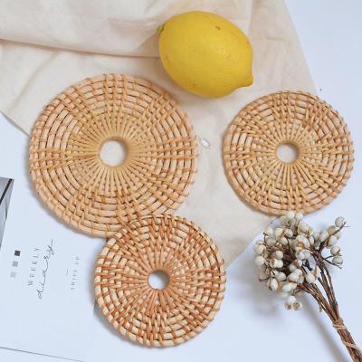 China Sustainable Wholesale Organic Bamboo Rattan Tea Coaster Vietnam Rattan Tray Set 8cm-18cm Round Rattan Coaster Set for sale