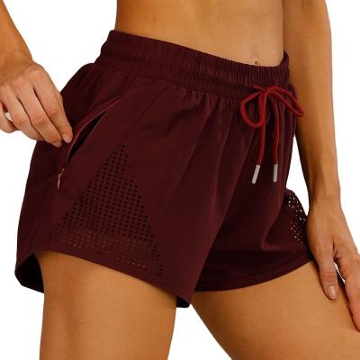 China Anti-Wrinkle Drawstring Women Elastic Yoga Pants With Pockets Nets Shorts Gym Shorts Summer Running Shorts for sale