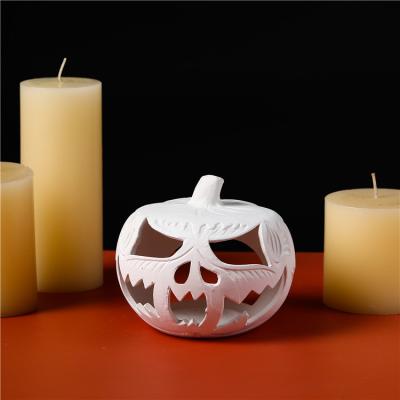 China Safety Creative design home halloween decoration pumpkin shape candle jar diy coloring ceramic candle holders for sale