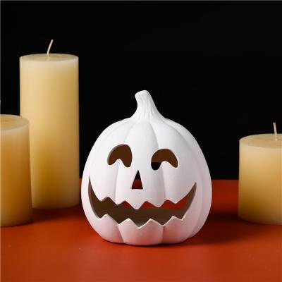 China Safety Hot selling halloween decoration candle jars creative pumpkin ceramic diy color candle holders for sale