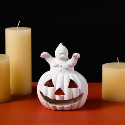 China Safety Halloween decoration creative design pumpkin shape candle jar kids diy color ceramic candle holder for sale