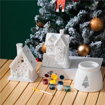 China Safety Custom logo kids christmas gift house shape diy color ceramic candle holder christmas gift item for sale