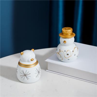 China Unique Art Decor Nordic Style Fancy Gift Crafts Luxury Ceramic Snowman Christmas Desk Ornaments Home Decor for sale