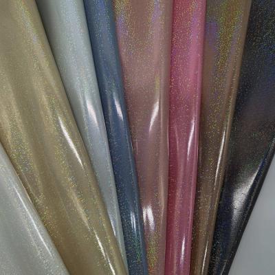 China Other Newly Developed Peacock Dreamlike Metallic Film PU Embossed Leather For Shoes And Bags for sale